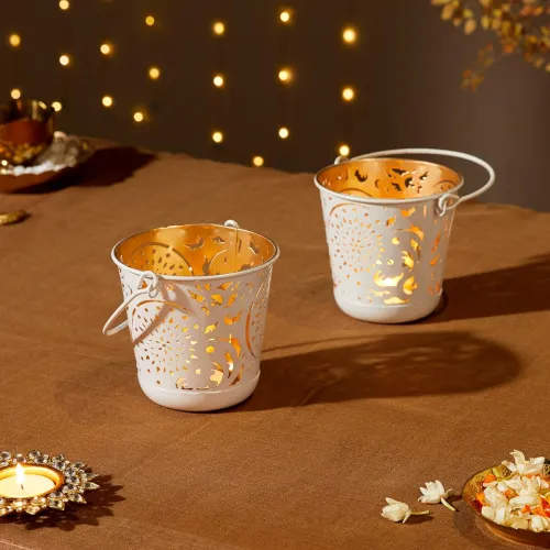 Amazon Brand – Solimo Tea Light Votive – Round Shape with Handle, White Powder-Coated Iron with Gold Interior, Set of 2 (Size: L-11 cm x W-11 cm x H-10 cm) Amazon Brand – Solimo Tea Light Votive – Round Shape with Handle, White Powder-Coated Iron with Gold Interior, Set of 2 (Size: L-11 cm x W-11 cm x H-10 cm)